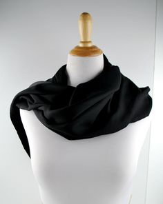 Measures 20" x 70" Fine Satin polyester, Soft Feel Solid Black Satin on one side Nice fold to fabric, light airy feel Two side sewn together nice fold and hang to wrap   Inventory # 93 Fabric Light, Black Satin, Solid Black, Scarf Wrap, Satin, Fabric, Black