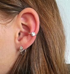 MUCH HAVE Minimal and small moon conch piercing/hoop earring.Super versatile and they're perfect to wear in multi pierced ears.PLEASE NOTE, this listing is for one real conch hoop earring ( for pierced ears), if you want one Ear Cuff for non pierced ears ( Fake Piercing), please buy it here:https://www.etsy.com/listing/663036982/moon-ear-cuff-conch-piercing-celestial?ref=shop_home_active_1&pro=1&frs=1Matching stud earrings available here:https://www.etsy.com/listing/609797552/moon-earrin Everyday Round Ear Cuff With Ear Wire, Adjustable Round Ear Cuff For Everyday Wear, Adjustable Small Hoop Pierced Ear Cuff, Everyday Round Nickel-free Ear Cuff, Everyday Nickel-free Round Ear Cuff, Dainty Round Ear Cuff For Pierced Ears, Adjustable Small Hoop Single Ear Cuff, Dainty Round Ear Cuff, Minimal Ear Piercings