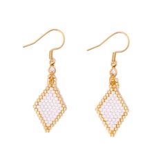 two pairs of gold tone earrings with white beads