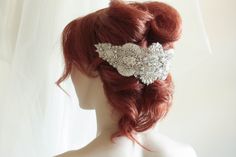 Vintage inspired beading gives a nostalgic picturesque look to every wedding attire. Each piece is carefully handcrafted using opulent swarovski stones and silk thread, making it a perfect heirloom head dress Colors : Ivory, offwhite and silverLength = 10 inchesMax width in the center is about 4 approximatelyFastening Options:1. Small comb on either side2. Ribbon - if you would like to wear this as a headband Shipping : Made to order, please allow 4 to 6 weeks to complete work Shop Policy : Due Embellished Crown Headpiece For Weddings, Vintage Wedding Headband Headpiece, Elegant Embellished Crown Headpiece, Vintage Wedding Headband, Elegant Crystal Headpieces For Weddings, Elegant Crystal Embellished Crown Headpiece, Elegant Handmade Headpieces For Wedding, Crystal Headband For Wedding, Elegant Handmade Wedding Headpieces