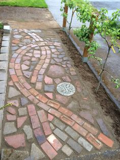 a brick walkway with a fire hydrant in the middle