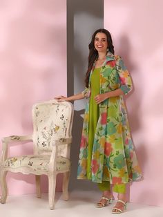 This Green Women Floral Printed Empire Kurta with Trousers is a versatile and stylish outfit. The kurta features a beautiful floral print, A-line shape, and empire style, creating a flattering silhouette. The trousers are solid and have a partially elasticated waistband for a comfortable fit. Made with silk blend machi Summer Anarkali Floral Print Sets, Summer Anarkali Set With Floral Print, Spring Palazzo Set With Straight Kurta And Printed Motifs, Spring Palazzo Set With Printed Motifs And Straight Kurta, Festive Spring Sets With Floral Print, Spring Floral Print Straight Kurta Sets, Multicolor Palazzo Set For Festive Spring Occasions, Spring Festive Multicolor Palazzo Set, Multicolor Floral Print Kurta For Spring