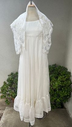 Vintage white Maxi boho chiffon dress beaded with shawl custom made XS. Good condition but few pearl drop beads missing. Train style dress with sheer lace sleeves, wedding dress style . Possibly acetate and rayon fabric. Measurements  Shoulders 14" Sleeves 17" Bust 34" High waist 26" Waist 36" Hips 40-50" Length 56"-60" Shawl 45" x 31" x 2-21" Summer Dress With Lace Sleeves And Fitted Bodice, Bohemian Chiffon Dress With Lace Trim, Bohemian Flowy Dress With Lace Bodice, Flowy Bohemian Dress With Lace Bodice, Bohemian Dress With Lace Bodice For Garden Party, Bohemian Lace Bodice Dress For Garden Party, Fitted Chiffon Lace Dress For Summer, Elegant Flowy Lace Dress With Lace Sleeves, Summer Lace Dress With Fitted Bodice And Lace Sleeves