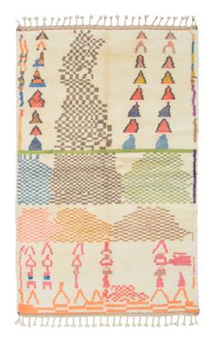 an old rug with different colored designs on the front and back of it, including arrows