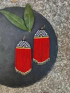 Traditional Fringed Beaded Earrings, Traditional Fringe Beaded Earrings With Round Beads, Traditional Beaded Earrings With Fringe And Round Beads, Traditional Fringe Drop Earrings, Traditional Fringe Dangle Jewelry, Traditional Fringe Beaded Drop Earrings, Red Beaded Fringe Dangle Earrings, Festival Fringe Earrings With Round Beads, Red Bohemian Earrings With Dangling Beads