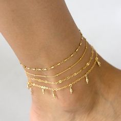 "Beautiful dainty chain anklets in 14K gold or sterling silver. Our delicate anklets are offered in four unique styles: dew drop, tube chain, lace chain or satellite chain. Pick one or more for a custom layering look just for you! *listing is for ONE delicate anklet in chain of your choice D E T A I L S * choice of chain: dew drops, tube chain, lace chain or satellite chain * 100% 14K gold fill or sterling silver chain and findings * spring clasp closure * Made in USAhandmade with love in San Di Gold Chain Anklet, Simple Chain Necklace, Dainty Chain Necklace, Anklet For Women, Beautiful Beaded Bracelet, Message Bracelet, Beaded Anklet, Morse Code Bracelet, Dainty Chain