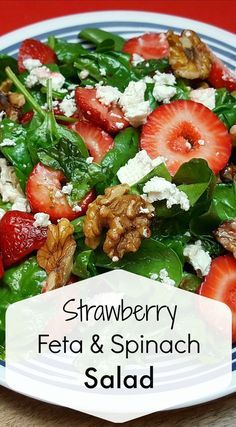 strawberries, feta and spinach salad on a plate with the words strawberry feta & spinach salad