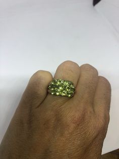 Rich and very bright Peridot green ring Sterling silver with gold rhodium finish Size 8 can be sized by my jeweler. His service charge is $10 All rings are shipped in a nice gift box. Check out our over a THOUSAND great reviews Engraving is $4 per letter and is not always perfect depending on the piece. It can take a few days if the jeweler is busy. This is payable to Paypal Judithsltd@gmail.com Unique Green Crystal Ring In Sterling Silver, Unique Green Sterling Silver Crystal Ring, Green Peridot Crystal Ring With Gemstone, Green Peridot Rings For Anniversary, Green Peridot Gemstone Crystal Ring, Green Peridot Crystal Ring For May Birthstone, Green Peridot Crystal Ring, Green Round Crystal Ring In Fine Jewelry Style, Green Round Crystal Ring Fine Jewelry