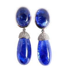 Thomas Leyser is renowned for his contemporary jewellery designs utilizing fine coloured gemstones and diamonds. These pair of earrings in 18K white gold (13.38g) are set with 2x fine Tanzanite Cabouchons (oval, 16x12mm, 21.76ct). + 2x Tanzanite Briolets (28.5x13.2mm, 53.53ct) + 56x Diamonds (brillant-cut, 1mm, G/VS, 0.56ct). Currently clips at the back which can be replaces by studs. Rose Gold Drop Earrings, Contemporary Jewelry Design, Tanzanite Jewelry, Geode Earrings, Diy Jewelry Necklace, Silver Jewelry Necklace, White Gold Earrings, Vintage Chandelier, Contemporary Jewellery