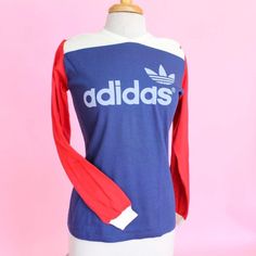 Vintage 70s retro sport Adidas color block long sleeve tee Label: adidas  100% combed cotton (insanely soft and thick) Overall excellent condition  Measurements  Pit to pit: 18" flat Waist: 18" flat Shoulder to hem: 25" Material has stretch  📀 free USA shipping 📀 #70s #sporty #vintage #retro #adidas Sporty Long Sleeve T-shirt With Logo Print, Vintage Long Sleeve T-shirt For College, Retro Long Sleeve Sports T-shirt, Retro Long Sleeve T-shirt With Screen Print, Sporty Long Sleeve T-shirt For Spring, Varsity Long Sleeve Sports T-shirt, Retro Long Sleeve T-shirt For Spring, Varsity Color Block Long Sleeve Sweatshirt, Sports Tops With Three Stripes For Fall