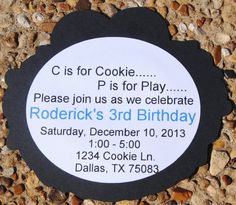 a black and white birthday party card with a cookie on it's back side