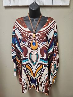 Great top for the fall season vibrant colors in a Geometric design. Very soft to the touch. Great with a pair of dress pants or denim. One size fits small to 2X Viscose, Polyester Hand Wash, Hang Dry Casual Blouse With Abstract Print For Fall, Casual Abstract Print Blouse For Fall, Trendy Multicolor Print Tops For Fall, Colorful Casual Fall Blouse, Casual Fall Blouse In Bright Colors, Casual Abstract Print Tops For Fall, Casual Colorful Fall Blouse, Multicolor Tops For Fall, Multicolor Print V-neck Top For Fall