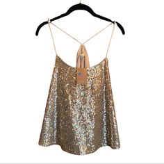 Sold By American Threads Boutique Brand: Alythea Gold Sequin Trapeze Tank Racerback Formed By 2 Silky Spaghetti Straps(Not Adjustable) Unleash Your Inner Disco Queen In This Modern Take On A Classic Studio 54 Ensemble. Style Under A Blazer For Work Or W/Your Fav Mini & Faux Fur Coat For A Glamorous Date Night Look. This Cut Is Super Flattering! Front&Back Covered In Sequins Straps/Lining Satin(Poly) Approx Meas. Pit-Pit: 18.25” Unstretched (21.5”) L: 22.5” Imo Fits Us 6-10 Depending On How You W Glamorous Sleeveless Top With Built-in Bra, Glamorous Backless Tank Top For Summer, Cami Top With Straps For Night Out, Night Out Cami Top With Straps, Halter Neck Party Tops With Straps, Party Halter Neck Top With Straps, Spring Evening Cami Halter Top, Backless Vest Top For Night Out, Cami Top For Spring Parties