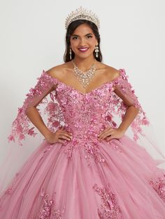 You'll love twirling around in this 3D floral applique long off the shoulder cape dress with A-line skirt by House of Wu 26052. Off-the-shoulder neckline with sequin lace appliqués and sparkle tulle ball gown skirt. Has a lace-up back and train. The detachable cape is included - giving you a versatile second look! House of Wu Quinceanera Collection Spring 2023 Style Number: 26052 Fabric: Tulle/Sequin Lace Appliques/3D Floral Appliques Please note: There may be a loss of glitter while wearing thi Quince Planning, Era Dresses, Floral Cape, Watteau Train, Quinceanera Collection, Detachable Cape, Mary's Bridal, Debutante Ball, Tulle Balls