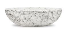 a white marble bowl sitting on top of a table