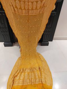 Indian translational BANDHANI Banarasi georgette dupatta.  Colour : Yellow  BANDEJ :WHITE LENGTH 2.5 MTR GOLDEN JARI PALLU BORDER Bandhani Print Dupatta For Diwali, Yellow Chanderi Dupatta With Zari Work, Yellow Sharara With Dupatta In Traditional Drape, Yellow Georgette Anarkali Set With Zari Work, Traditional Yellow Saree With Sheer Dupatta, Gold Lehenga With Chikankari Embroidery In Georgette, Mustard Salwar Kameez With Dupatta For Diwali, Bollywood Style Mustard Dupatta For Festive Occasions, Semi-stitched Yellow Saree With Sheer Dupatta