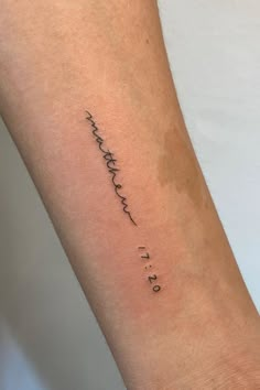 a woman's arm with the word love written in cursive writing on it