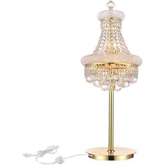 a gold table lamp with a crystal ball shade on the base and plugged in