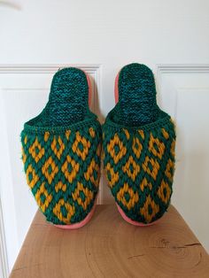 Fun green, yellow and pink knitted slippers with plastic bottom Perfect for winter or fall  Slightly worn Comfortable Multicolor Slip-on Slippers, Green Comfortable Slippers With Round Toe, Yellow Slip-on Slippers For Winter, Yellow Slip-on Winter Slippers, Comfortable Green Closed Toe Slippers, Comfortable Multicolor Flat Slippers, Multicolor Non-slip Slip-on Slippers, Green Non-slip Closed Toe Slippers, Comfortable Green Slippers For Winter