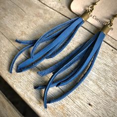 "-These tassel earrings are made from soft cadet-blue deerskin leather. Part Western, part Boho, part Rock 'n Roll, these little fringe earrings give a big kick to any outfit. -Lightweight enough to wear every day. -3\" - 3.5\" total length, including earwires. -Earwires are antique-brass. -Deerskin leather is sustainably sourced in the USA. -Ok to get wet. -Available in 10 colors. -Designed and handmade in South Pasadena, CA. Check out more of our awesome earrings here: https://www.etsy.com/sho Blue Fringe Earrings As Gift, Blue Fringe Earrings For Gift, Blue Dangle Tassel Earrings With Fringe, Blue Fringe Drop Earrings, Blue Fringe Tassel Drop Earrings, Dangly Earring, Awesome Earrings, Fringe Earring, Diy Leather Earrings