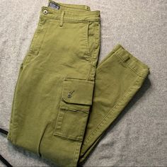 Size 32, Never Worn, Great Condition Casual High Waist Olive Bottoms, Olive High-waist Pants With Pockets, High-waist Olive Pants With Pockets, Olive High-waisted Bottoms With Pockets, High Waist Olive Cotton Pants, Levi's Full-length Bottoms With Pockets, Levi's Full Length Bottoms With Pockets, Khaki Mid-rise Cargo Jeans, Casual Olive Pants With Belt Loops