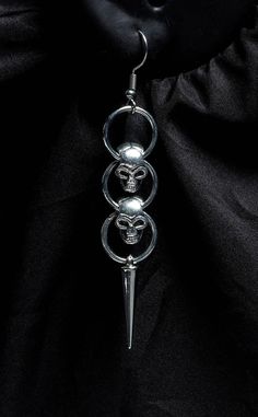 Terrify the competition with these Hanging Skulls Earrings. Lightweight and evil-looking, they'll give any outfit an edgy spike. Made of lightweight materials, these skull earrings make a statement without weighing down your ears. Measurements: 1cm x 6cm. Hanging Skulls, Stand Out From The Crowd, Skull Earrings, Gothic Jewelry, Buy Now, Gothic Jewellery