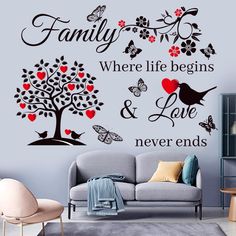 a living room with a couch and wall decal that says family where life begins and love never ends