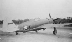 an old airplane sitting on top of a tarmac