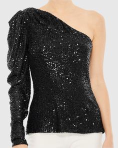 Dazzle at your next special occasion in our One Shoulder Puff Sleeve Sequin Top, a captivating choice designed to make you stand out. With its eye-catching sequin detailing and one-shoulder puff sleeve design, this top is a show-stopping statement piece that pairs elegantly with a chic skirt and statement earrings for a look that's sure to turn heads. Mac Duggal Sequin fabric (100% Polyester) One shoulder neckline Puff long sleeve Available in Black (Final Sale) Style #R26832 Final Sale - Item i Puff Sleeve Design, Vestidos Color Coral, Shoulder Puff Sleeve, Chic Skirt, Chic Skirts, Puff Long Sleeves, Mac Duggal, Sequin Fabric, Sequin Top