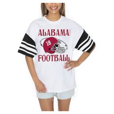 Showcase your Alabama Crimson Tide pride in style with the Gameday Couture Starting Lineup Contrast Sporty Heritage Oversized T-Shirt. The oversized fit provides a trendy and relaxed look, making it perfect for game day or any casual occasion. Made from 100% cotton, this tee offers exceptional comfort and breathability, ensuring you stay cool and confident while cheering on the Alabama Crimson Tide. Spring Varsity T-shirt With Graphic Print, Sports Event Tops With Team Name, Collegiate Tops For Sports Events In Spring, Collegiate Tops For Spring Sports Events, Varsity Tops For College In Spring, Varsity Tops For College Spring Season, White Varsity Top For College, White School Spirit Top For Spring, Collegiate Style Tops For Spring Sports Events