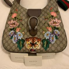 Gucci Patchwork Tiger And Gg Handbag- Can Be Worn Through The Arm Or Crossbody Never Used - Comes With Dust Bag, Cards, Box, And Original Shopping Bag! Gucci Multicolor Tote Bag, Designer Gucci Bag With Branded Hardware, Designer Gucci Shoulder Bag, Gucci Designer Bag With Detachable Handle, Designer Gucci Shoulder Bag With Detachable Handle, Gucci Beige Shoulder Bag With Handles, Beige Gucci Shoulder Bag With Handles, Designer Gucci Tote Shoulder Bag, Luxury Embroidered Top Handle Shoulder Bag