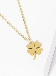 Meet your new lucky charm. 16” gold chain necklace with an extender and clover pendant in the center. The shamrock has long been associated as a good luck talisman, so go ahead and add some luck to your jewelry box. Pair it with our Coffee Run Hoops and Secret Garden Necklace for a complete look! 16" + extender Dainty Flower Pendant Charm Necklace For Good Luck, Good Luck Charm Necklace With Delicate Chain, Dainty Necklace With Adjustable Chain For Good Luck, Dainty Flower Pendant Jewelry For Good Luck, Dainty Delicate Chain Jewelry For Good Luck, Dainty Good Luck Jewelry With Flower Pendant, Dainty Good Luck Flower Pendant Charm Necklace, Dainty Yellow Gold Charm Necklace For Good Luck, Good Luck Yellow Gold Necklaces With Delicate Chain