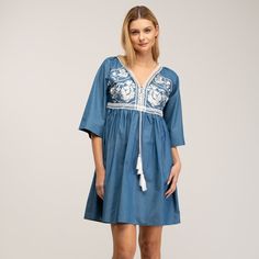 Boho-chic style with a modern accent. This denim mini dress features a spectacular embroidery detail in the chest, as well as romantic oversize french sleeves  and tassels to add more charm to this beautiful dress. Got any cowboy boots? It will be the perfect match! 100% Cotton. Wash Machine  30º ,  Press Medium  Temperature, Do  not  use spin-dry, Do not Bleach Spring Cotton V-neck Embroidered Dress, Casual Spring Dresses With Embroidered Hem, Chic Embroidered Spring Mini Dress, Spring Embroidered Mini Dress, Chic Embroidered Cotton Mini Dress, Chic Cotton Dress With Floral Embroidery, Spring Embroidered V-neck Mini Dress, Spring Floral Embroidery Knee-length Mini Dress, Spring V-neck Embroidered Mini Dress