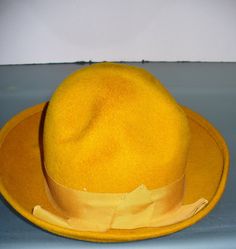 This hat is in wonderful condition with no mentionable issues. Elegant statement piece. Marked Size medium. Measures Circumference 22" Please measure carefully and feel free to ask more questions regarding size and condition as there are no refunds or exchanges. Lot BR r-2 Ladies Hat, Buffalo Ny, Mustard Yellow, Hats For Women, Caps Hats, Mustard, Accessories Hats, Art Collection, Bathing Beauties