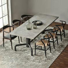 a dining table with six chairs around it