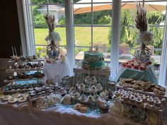 a table filled with lots of desserts and pastries