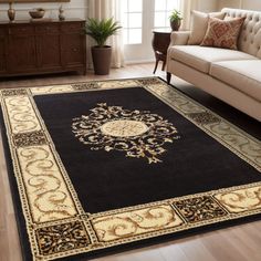 a living room with a couch, chair and rug