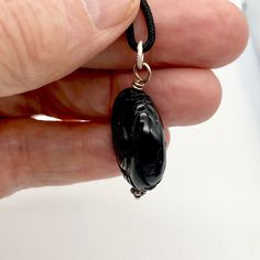 EXOTIC Carved Long Life Obsidian Bead Pendant! This pendant of Black Obsidian will give you a great contrast for your jewelry! It has been intricately hand carved with the Chinese Long Life character. The detailing on these pendant is exquisite! It is the same front and back. Don't miss out on this once in a lifetime find! NOTE: Images do not reflect number and size. Please see detail and table for information. Quantity: 1 pendantMaterial Type: Obsidian Size: 25x10mm Color: Black Legend: This sy Obsidian Pendant Amulet Necklace, Obsidian Amulet Pendant Necklace, Obsidian Pendant Jewelry Gift, Black Amulet Pendant Jewelry, Obsidian Pendant Jewelry For Gifts, Black Amulet Style Pendant, Spiritual Obsidian Pendant Jewelry, Black Oval Agate Jewelry, Obsidian Amulet Necklace As Gift