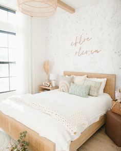 a bedroom with a large bed and white walls