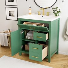 a bathroom vanity with drawers and a mirror above it