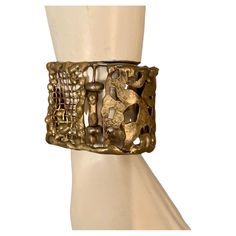 This is part of Chairish's Costume Jewelry Collection.  A striking cuff bracelet composed of hand made panels of brass and bronze by Pal Kepenyes in several different brutalist designs is from the same estate as the Milagros necklace.  This piece is unsigned and at some point the previous owner replaced the clasp.  It is in good, unsigned condition. Measurements; Length 7"    Width 1.75" Modernist Gold Metal Cuff Bracelet, Bronze Hand Forged Metal Cuff Bracelet, Hand Forged Bronze Metal Cuff Bracelet, Hand Cast Bronze Metal Cuff Bracelet, Unique Bronze Metal Cuff Bracelet, Vintage Gold Hand Cast Cuff Bracelet, Modernist Bronze Brass Jewelry, Hand Forged Gold Brutalist Jewelry, Brutalist Hand Forged Gold Jewelry