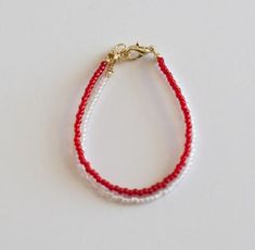 "If you would like to add gold filled hardware to a bracelet, please use this link to purchase it along with the bracelet. You will need to purchase one for EACH bracelet you would like to add gold filled hardware to. https://www.etsy.com/LittleLovliesShop/listing/860546443/gold-filled-upgrade?utm_source=Copy&utm_medium=ListingManager&utm_campaign=Share&utm_term=so.lmsm&share_time=1598757365437 This Holiday Bracelet is the perfect accessory to go with all your holiday outfits! Th Adjustable Handmade White Gold Bracelet, Adjustable White Chain Bracelet With Lobster Clasp, Holiday Bracelet, Toddler Bracelet, Holiday Bracelets, White Bracelet, Baby Jewelry, White Bracelets, Holiday Outfits