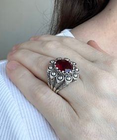 Ruby Gemstone Silver Gothic Filigree Ring, 925 Sterling Silver Handmade Ornate Bold Cocktail Ring Jewelry, Ring Gift for Sister Her Red gemstone ring, oval goth gift ring, daisy petals ring, filigree jewelry, birthday gift her, wedding gift ring Material: 925 Sterling Silver ( NICKEL FREE ) Gemstone: Ruby Quartz 10x12 mm. -The Ruby Gemstone Silver Gothic Filigree Ring is an exquisite fusion of boldness and sophistication. Handcrafted from 925 sterling silver, its intricate Gothic filigree design Handmade Elegant Sterling Silver Ruby Ring, Handmade Sterling Silver Ruby Ring, Artisan Sterling Silver Rings With Intricate Design, Sterling Silver Engraved Gemstone Ring, Handmade Ruby Ring In Sterling Silver, Handmade Elegant Ruby Ring In Sterling Silver, Sterling Silver Filigree Ring With Gemstone, Ornate Rings With Accent Stones For Gift, Ornate Sterling Silver Filigree Ring With Stone Setting