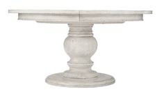 an old white pedestal table on a white background