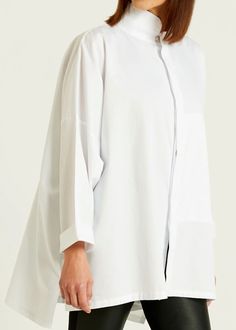 A timeless signature shirt is now available in Planet's fine cotton rib. Style features: a chic mandarin collar and front hidden pocket proven to be a true lifesaver. Details: Mandarin Collar Button Front Placket 100% Cotton Machine Wash Cold One Size (sizeless) Modern White Blouse With Concealed Placket, Timeless Daywear Tops With Placket, Timeless Tops With Placket For Daywear, Classic Shirt With Relaxed Fit And Stand Collar, Modern Tops With Pockets For Daywear, Stand Collar Shirt With Placket For Workwear, Workwear Shirt With Stand Collar And Placket, Modern Spring Shirt For Layering, Modern Shirt For Spring Layering