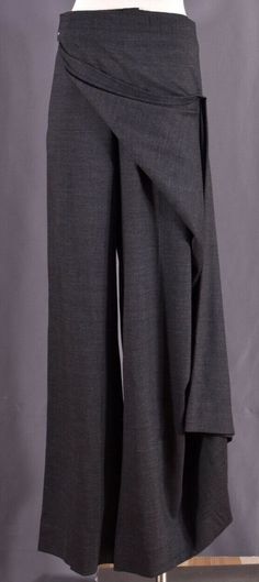 Vintage Authentic JEAN PAUL GAULTIER Gray Wool Wrap Skirt Apron Women's Pants Trousers IT 48 US 14 RARE to Find!!! Absolutely in Excellent Condition  measurements are :  the length: 44 " the inseam: 34" the waist flat: 19.5"  100% Made in italy FREE SHIPPING!! #######################################################   Merchant_info guarantees that all watches and brand name items is 100% authentic and original. We have years of experience in selling watches and collector's item all over the world Wide-leg Bottoms For Winter Formal, Formal Wide Leg Bottoms For Winter, Elegant Long Pants For Winter, Fall Fitted Wide Leg Culottes, Fall Wide Leg Fitted Culottes, Winter Formal Stretch Bottoms, Wide Leg Office Bottoms For Winter, Wide Leg Bottoms For Office In Winter, Elegant Fitted Full Length Culottes