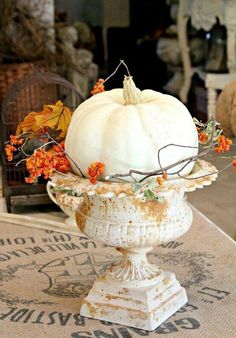 a white pumpkin sitting on top of a table