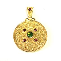 Inspired by the Greek byzantine era, this elegant 18k Gold Plated sterling silver round pendant follows the traditional Byzantine jewelry style with detailed patterns, rounded corners, and colorful stones. It is a unique pendant made with 925 sterling silver 18k Gold overlay.Sterling Silver18 Karat Gold Overlay Made In Byzantine Jewelry, Faberge Jewelry, Colorful Stones, Historical Women, Gold Overlay, Jewelry Style, Unique Pendant, Round Pendant, Style Jewelry