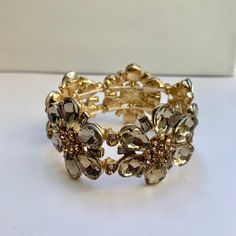 Beautiful Floral Rhinestone Crystal Bracelet. Stretchy Elastic Band. 1.5” Width. Glamorous Adjustable Metal Bracelets, Adjustable Glamorous Metal Bracelets, Glamorous Adjustable Metal Jewelry, Adjustable Sparkling Metal Jewelry, Elegant Jeweled Crystal Bracelet, Sparkling Adjustable Metal Jewelry, Elegant Jeweled Metal Crystal Bracelet, Gold Jeweled Crystal Metal Bracelet, Glamorous Adjustable Sparkly Jewelry