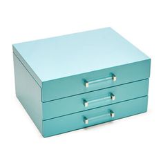 a blue box with three drawers on the front and one drawer open to show something